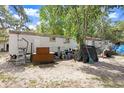 An old mobile home features aged siding and unkempt features at 10044 Oana St, New Port Richey, FL 34654