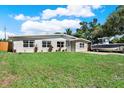 Single-story home featuring a spacious front yard and plenty of parking space for boat at 1029 Madison St, Largo, FL 33770