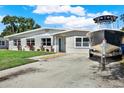 Lovely home with a well-kept front yard and space to park your boat at 1029 Madison St, Largo, FL 33770