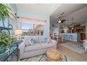 Bright living room with comfortable seating, natural light, and inviting decor at 10764 70Th Ave # 4305, Seminole, FL 33772