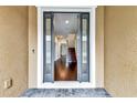 Spacious foyer with gleaming hardwood floors and a view of the staircase at 11613 Sweet Tangerine Ln, Tampa, FL 33626