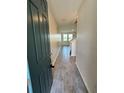 Welcoming entryway boasting sleek tile flooring and ample natural light at 11634 Woodleaf Dr, Bradenton, FL 34211