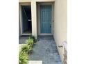 Close up of the front door that features nice landscaping around the entrance at 11634 Woodleaf Dr, Bradenton, FL 34211
