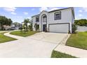 Inviting two-story home with a well-maintained lawn and a spacious driveway at 2746 Heathgate Way, Land O Lakes, FL 34638