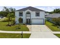 Charming two-story home with a well-manicured lawn, complemented by lush landscaping at 2746 Heathgate Way, Land O Lakes, FL 34638