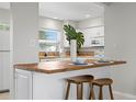 Open concept kitchen offers a breakfast bar with seating and modern appliances at 3901 17Th N Ave, St Petersburg, FL 33713