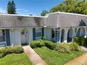 Inviting home exterior with lush landscaping, a stone pathway, and a well-kept lawn at 4207 Touchton Pl # 4207, New Port Richey, FL 34652