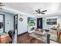 Spacious living room with media center and hardwood floors at 5001 37Th N Ave, St Petersburg, FL 33710