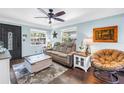 Comfortable living room with modern furnishings, lots of light, and hardwood floors at 5001 37Th N Ave, St Petersburg, FL 33710