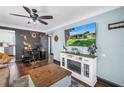 Inviting living room featuring a rustic fireplace and a dedicated workspace at 5001 37Th N Ave, St Petersburg, FL 33710