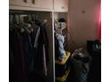 A closet filled with a variety of clothing at 516 7Th W Ave # 1, Palmetto, FL 34221