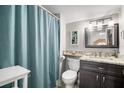 Cozy bathroom with a shower and a vanity with a granite countertop at 5567 Sea Forest Dr # 323, New Port Richey, FL 34652