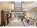 Bright living room featuring high ceilings, wood floors, and modern decor at 5567 Sea Forest Dr # 323, New Port Richey, FL 34652