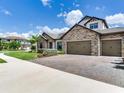 A beautiful brick paved driveway and stone accents highlight this gorgeous home at 6057 Marsh Trail Dr, Odessa, FL 33556