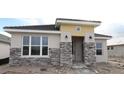 Inviting single Gathering home features stone veneer accents and a covered front entrance at 699 Allora Ave, Nokomis, FL 34275