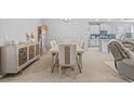 Open dining area flowing into kitchen, featuring modern table and decor at 11295 Timber Grove Ln, Brooksville, FL 34613