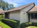 Home exterior with well-maintained lawn and tidy landscaping around the base at 2588 Laurelwood Dr # 16A, Clearwater, FL 33763