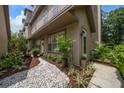 Inviting front exterior with a landscaped walkway leading to the entrance, enhanced by carefully selected plants at 2804 Countryside Blvd # 4, Clearwater, FL 33761