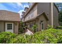 Well-maintained exterior featuring a private entrance with decorative landscaping and a charming walkway at 2804 Countryside Blvd # 4, Clearwater, FL 33761