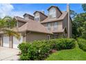 Exterior view showcasing the architecture and well-maintained landscaping of the residential property at 2804 Countryside Blvd # 4, Clearwater, FL 33761