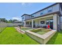 Inviting backyard with a jacuzzi, swimming pool, covered patio, and well-maintained lawn at 2866 Quail Crest Ct, Valrico, FL 33594