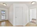 Bright hallway featuring tile flooring, neutral walls, and access to multiple rooms at 3111 W De Leon St # 9, Tampa, FL 33609