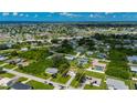Scenic aerial view of the property with a beautiful neighborhood and homes nearby at 3513 Syracuse St, Port Charlotte, FL 33952