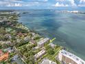 Aerial view of this property and its prime waterfront location on the bay at 602 Lime Ave # 102, Clearwater, FL 33756
