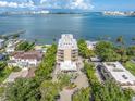 Amazing aerial view of the condo with water views and lush landscaping at 602 Lime Ave # 102, Clearwater, FL 33756