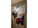 Functional bedroom featuring ceiling fan, with natural light and furniture; great starter space at 714 Gray S St, Gulfport, FL 33707