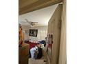 A bedroom with a ceiling fan and an AC unit in the window and view from the doorway at 714 Gray S St, Gulfport, FL 33707
