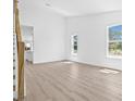 Bright living space with wood floors, white walls, and large windows at 7617 Alvina St, Tampa, FL 33625