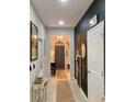 Inviting entryway featuring tiled floors and a chalkboard accent wall at 10824 Quickwater Ct, Riverview, FL 33569