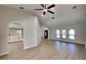 Bright living room with hardwood floors, high ceilings, elegant arched doorways, and natural light at 23344 Van Buren Ave, Punta Gorda, FL 33980