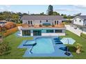 Backyard oasis with a private pool, spa, and spacious deck perfect for outdoor relaxation at 380 Colony Point S Rd, St Petersburg, FL 33705