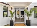 Inviting entryway with modern light fixtures and stylish interior design elements at 380 Colony Point S Rd, St Petersburg, FL 33705