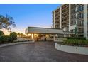 Beautiful condo exterior featuring a covered entry and meticulous landscaping at 4 Belleview Blvd # 305, Belleair, FL 33756