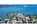 Breathtaking aerial view of the property with views of Sunshine Skyway and Isla Del Sol at 4735 Baywood Point S Dr, Gulfport, FL 33711