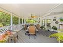 Spacious covered patio featuring a ceiling fan and outdoor dining set at 5270 White Sand Ne Cir, St Petersburg, FL 33703