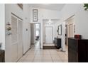 Bright entryway features tile flooring, coat closet and access to other rooms in the home at 6209 S Harold Ave, Tampa, FL 33616