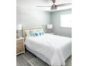 Comfortable bedroom with ceiling fan, modern decor and a serene atmosphere at 690 Fox St, Longboat Key, FL 34228