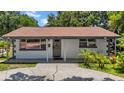 Inviting single-story home with a covered entrance and well-maintained front yard at 762 77Th N Ave, St Petersburg, FL 33702
