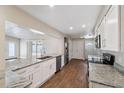 Modern kitchen boasts granite countertops and stainless steel appliances at 8306 N Gomez Ave, Tampa, FL 33614