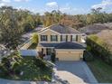 An aerial perspective of a well-maintained home in a lovely neighborhood at 8607 Tidal Breeze Dr, Riverview, FL 33569