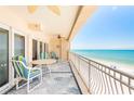 Enjoy breathtaking ocean views and sea breezes from this spacious balcony, complete with stylish seating and coastal decor at 17720 Gulf Blvd # A702, Redington Shores, FL 33708