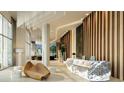 Elegant lobby with marble reception desk, modern lighting, and stylish seating area at 235 1St S Ave # 4101, St Petersburg, FL 33701