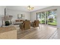 Bright living room with modern furnishings and scenic backyard views at 25737 Frith St, Land O Lakes, FL 34639