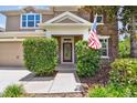 Close-up of the home's entrance and well maintained shrubs on either side of the front door at 3530 Brook Crossing Dr, Brandon, FL 33511