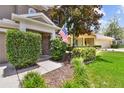 Charming front porch with stone accents and manicured shrubbery at 3530 Brook Crossing Dr, Brandon, FL 33511