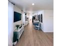 Bright, open-concept living room and kitchen with modern flooring and decor, creating a welcoming atmosphere at 368 6Th Nw St, Largo, FL 33770